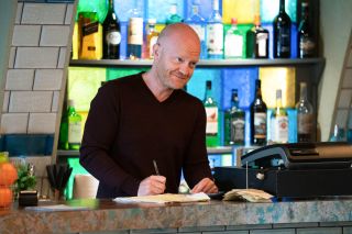 EastEnders Max Branning behind the bar at Walford East