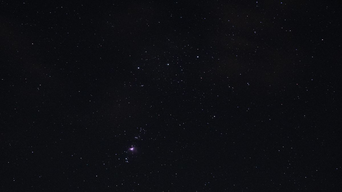 Orion's Belt, with the Orion Nebula visible in the night sky