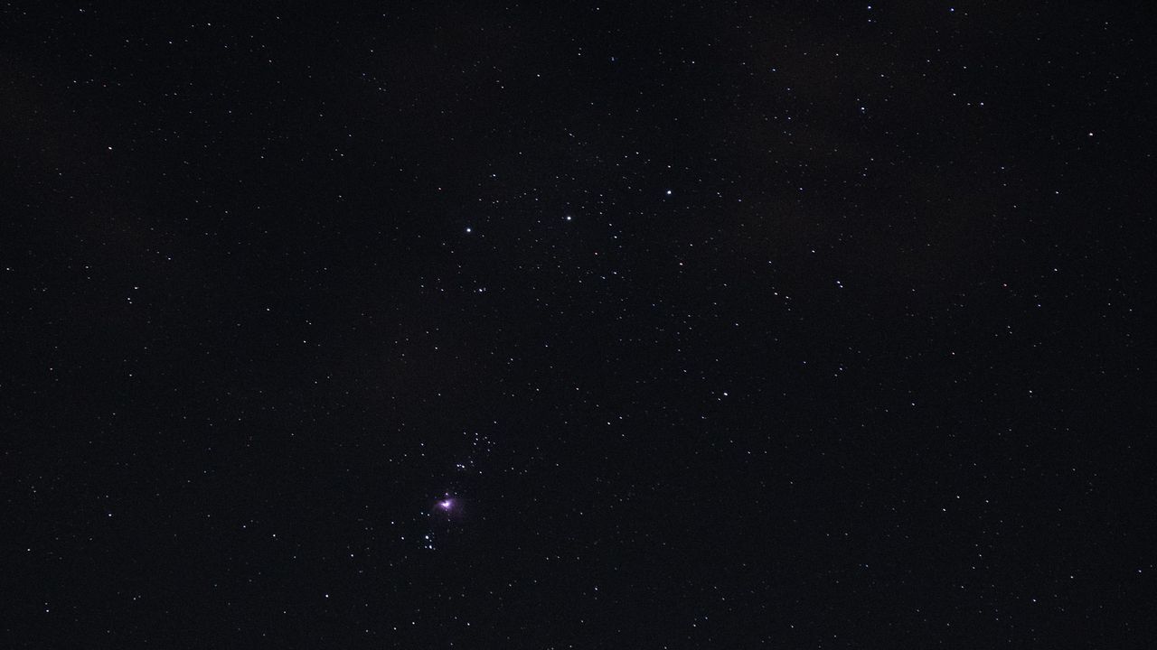 Orion's Belt, with the Orion Nebula visible in the night sky