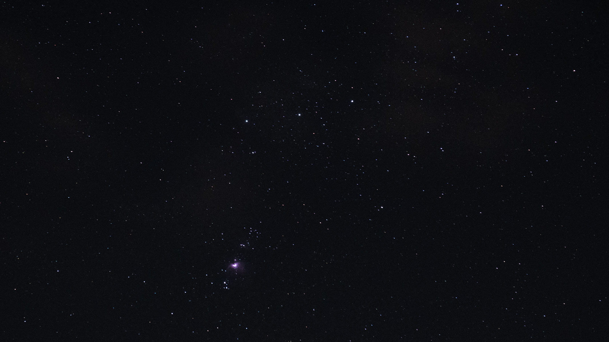 Orion's Belt, with the Orion Nebula visible in the night sky