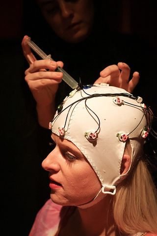 Caps with gel-tipped sensors monitored brain activity in audience members watching Cirque du Soleil.