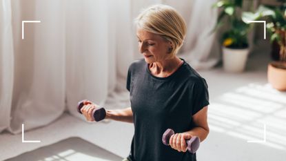 Woman holding two small dumbbells sitting on an exercise ball to represent strength training at home for beginners