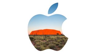 The Apple logo superimposed over Uluru in Australia, also known as Ayer's Rock