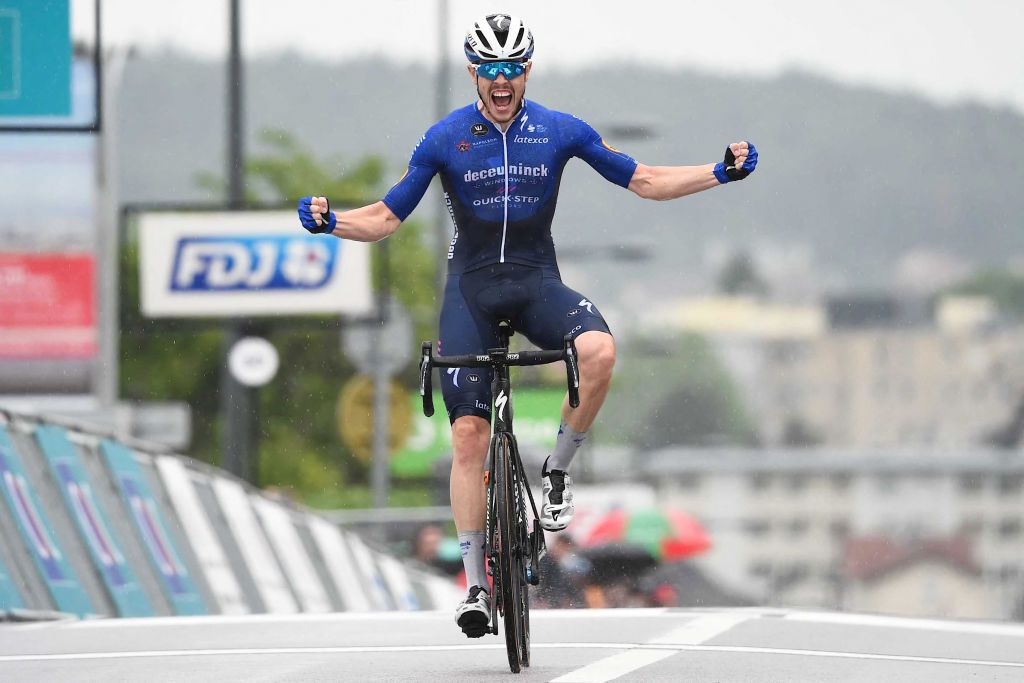 Remi Cavagna from Deceunick QuickStep team jubilates as he wins the French cycling championship in Epinal eastern France on June 20 2021 Photo by SEBASTIEN BOZON AFP Photo by SEBASTIEN BOZONAFP via Getty Images