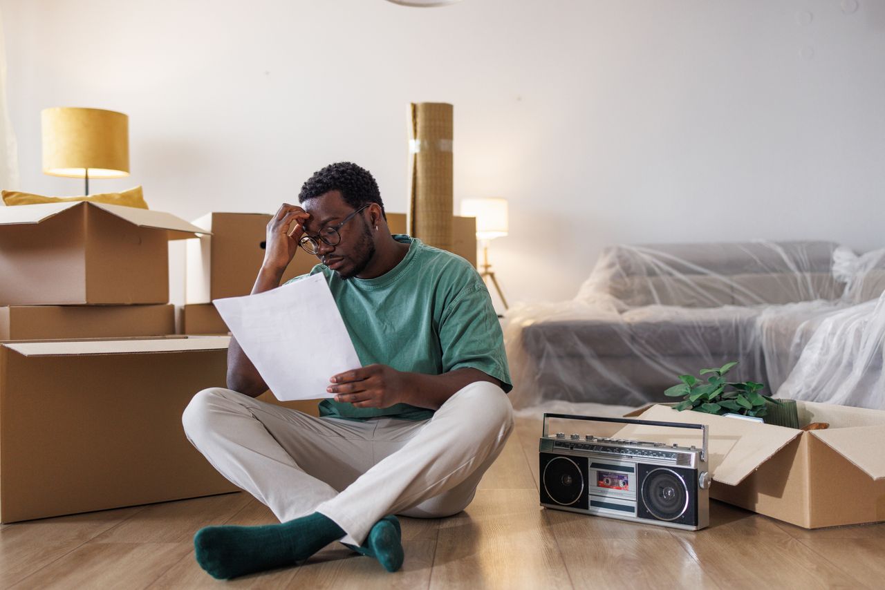 Young man packing up his things to move into a new apartment