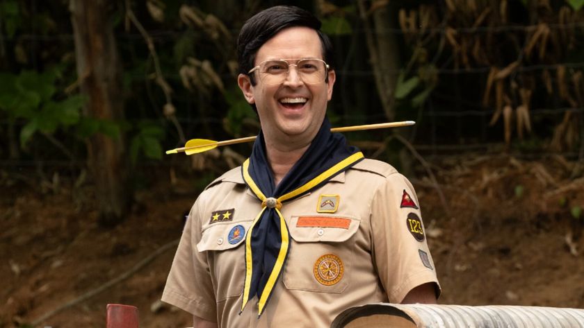 Pete smiling in Ghosts. He&#039;s wearing a scout uniform and there&#039;s an arrow going through his neck. 