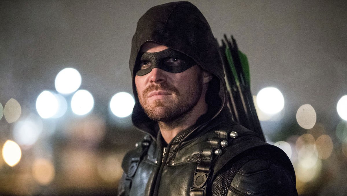 Stephen Amell looking intense dressed up as Arrow.