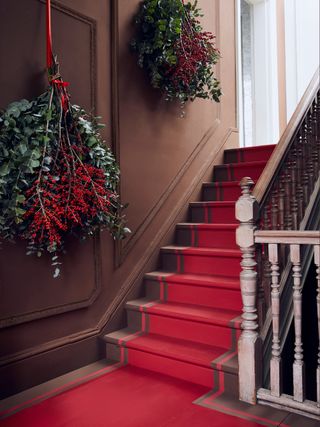Christmas hallway with hanging swags of evergreen