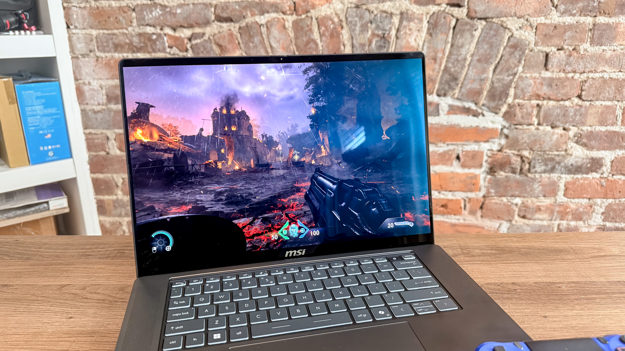 A closeup shot of the MSI Stealth 16 AI+ (2026)'s display showing Doom: The Dark Ages running