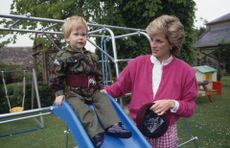 Princess Diana with Prince Harry wearing the uniform of the Parachute Regiment of the British Army in the garden of Highgrove House in Gloucestershire, 18th July 1986