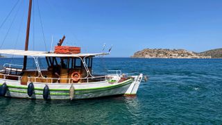 Take a short boat ride to Spinalonga island