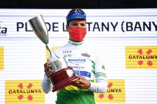 PLA DE LESTANY BANYOLES SPAIN MARCH 23 Podium Joo Almeida of Portugal and Team Deceuninck QuickStep Green Leader Jersey Celebration during the 100th Volta Ciclista a Catalunya 2021 Stage 2 a 185km Individual Time Trial stage from Pla de LEstany Banyoles to Pla de LEstany Banyoles 145m ITT Trophy Mask Covid Safety Measures VoltaCatalunya100 on March 23 2021 in Pla de LEstany Banyoles Spain Photo by David RamosGetty Images