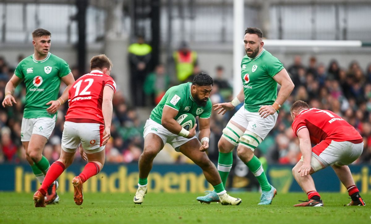 Bundee Aki of Ireland in action against Nick Tompkins and Tommy Reffell of Wales during Ireland vs Wales in the 2024 Six Nations