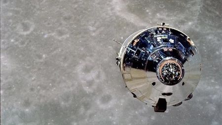 The Apollo 10 command module above the lunar surface. 