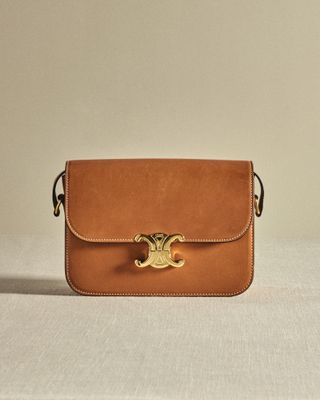 The Celine Classique Triomphe in classic tan with gold hardware