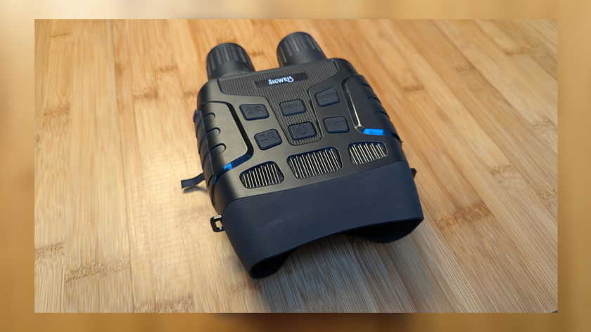 Sigweis Night vision binoculars on a wooden surface