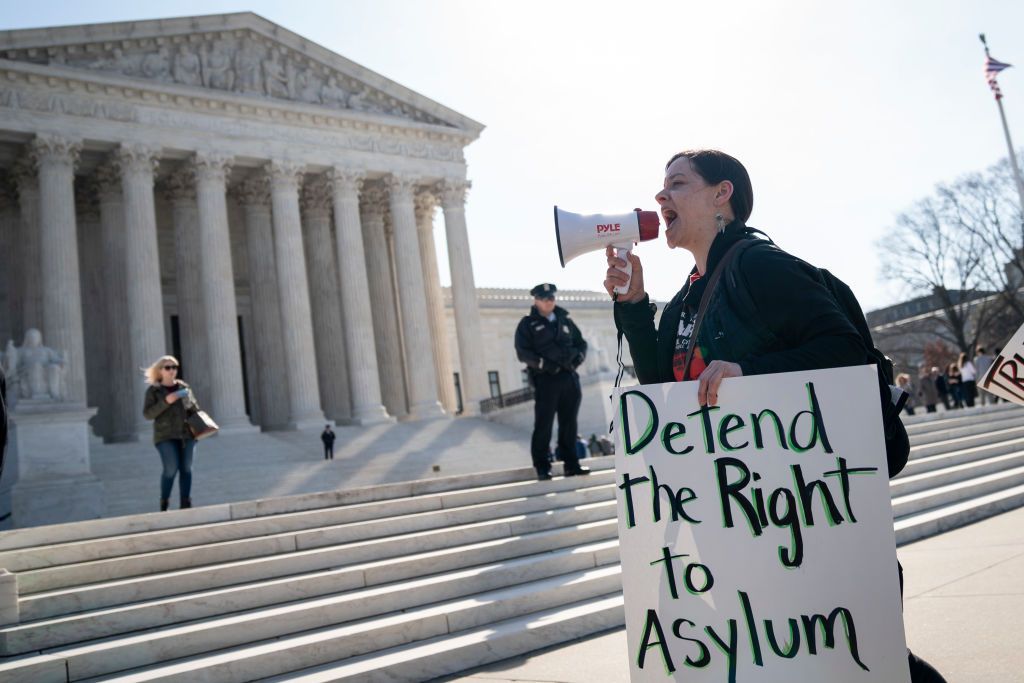 A protester in front of the Supreme Court.