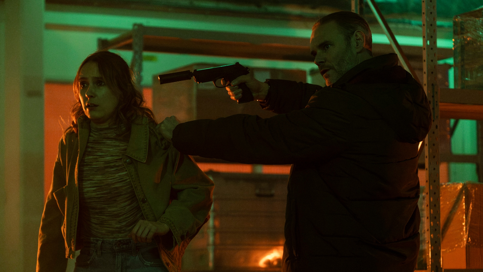 Braden holds a gun up to Alison's head in Code of Silence