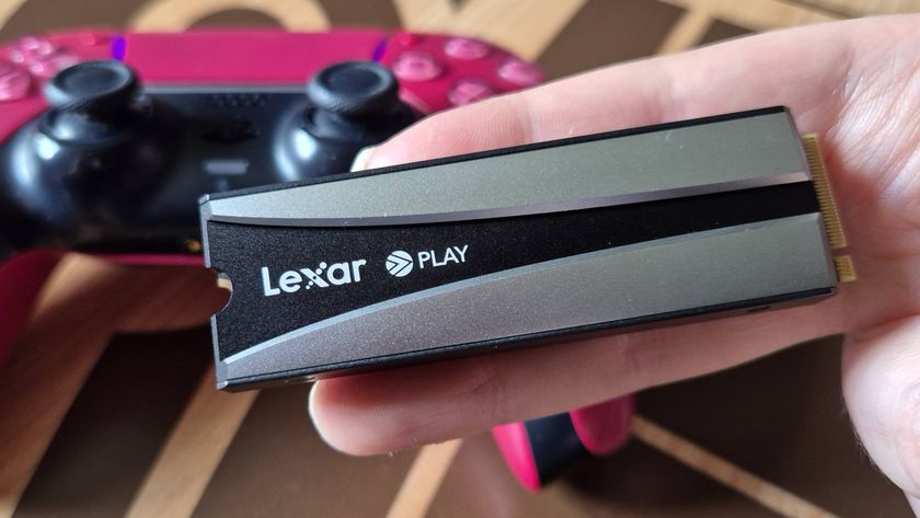 Photo by Rosalie Newcombe of the Lexar Play 2280 SE PCIe 4.0 PS5 SSD, sitting on a wooden coffee table.