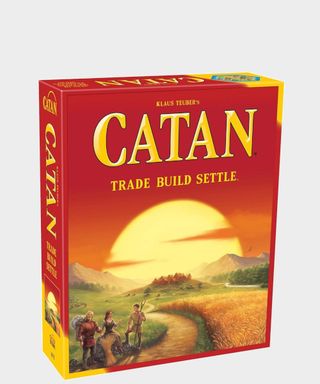 Catan box on a plain background