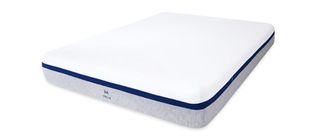 The Helix Midnight mattress shown with a light gray base and white cover