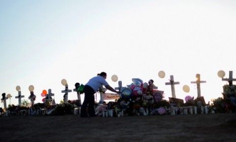 The makeshift memorial to the 12 who died