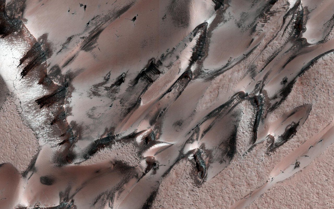 Carbon dioxide frost covers these megadunes on Mars as seen by the Mars Reconnaissance Orbiter.