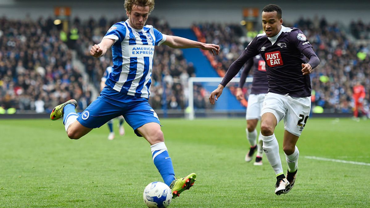 Brighton striker James Wilson takes on Marcus Olsson of Derby County