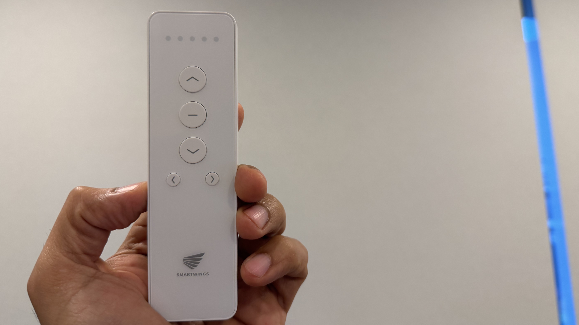 SmartWings remote held in hand