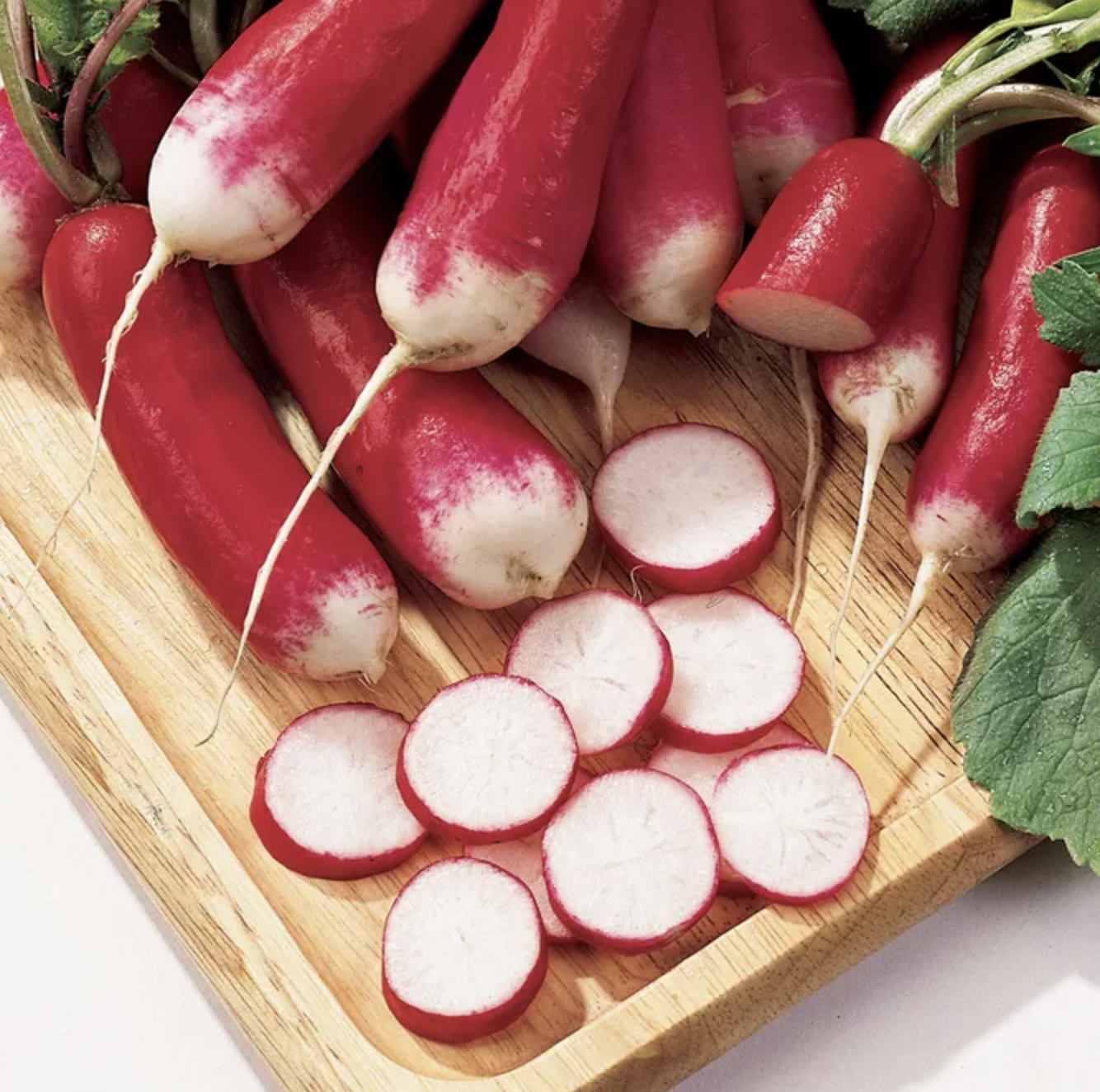 Burpee French Dressing radishes harvested and sliced on a chopping board