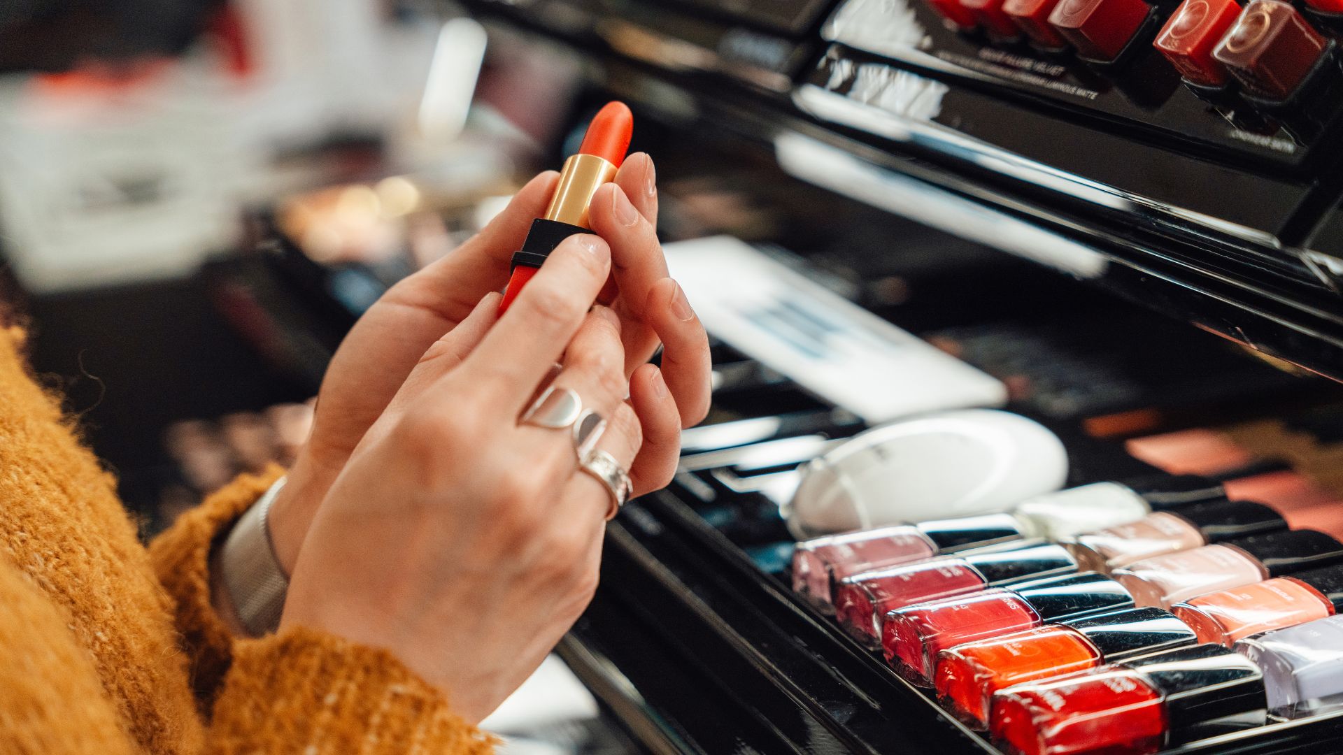 Woman buying a new lipstick