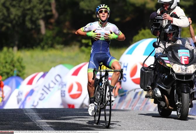 Orica-GreenEdge's Adam Yates crosses the line first at the Stage 6 finishing summit at the Tour of Turkey