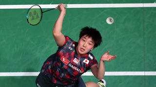 Overhead shot of Japan's Akane Yamaguchi taking aim at a shuttlecock in mid-air ahead of the All England Badminton Championships 2024