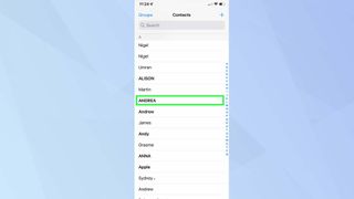 Screenshot of iOS 15 Contacts app with a contact highlighted