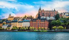 Panoramic city view with historic buildings along the waterfront of Sodermalm district, a southern district of Stockholm City Centre.