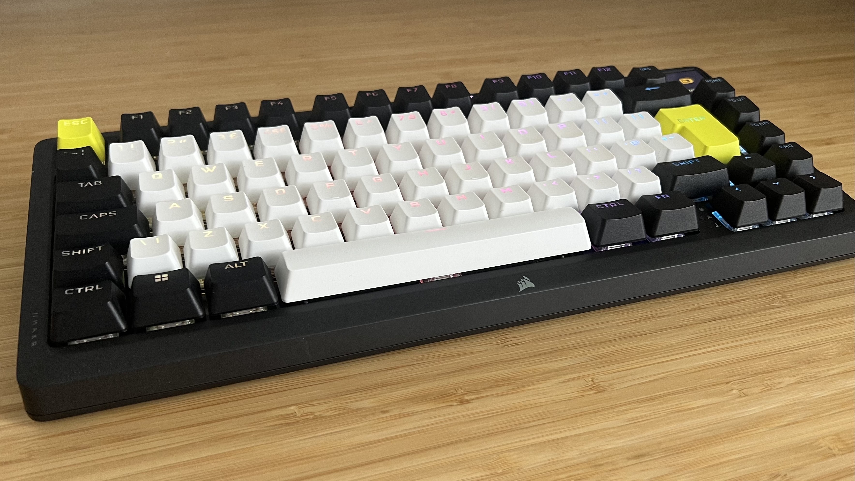 Corsair MAKR 75 gaming keyboard on a wooden desk
