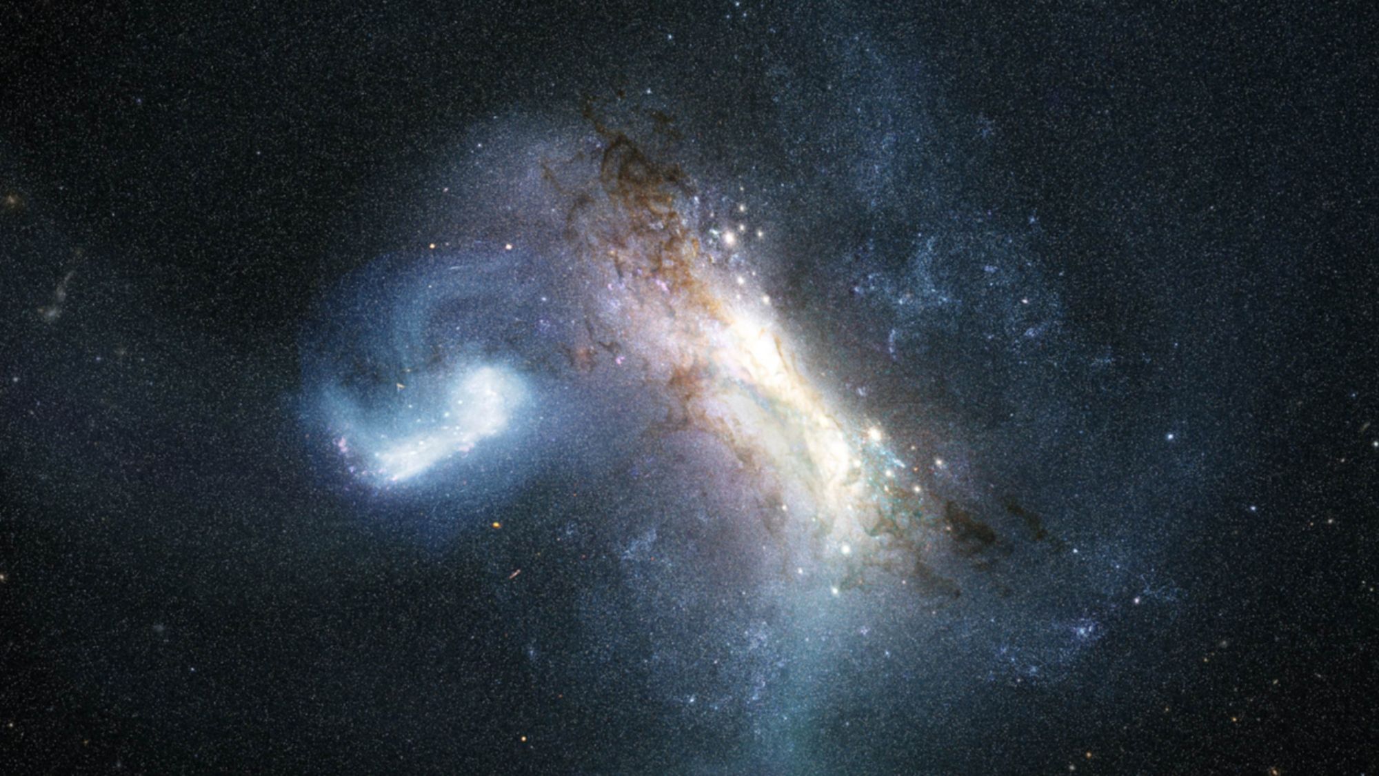A bunch of white, blue and brownish swirls against a dot-speckled section of space.
