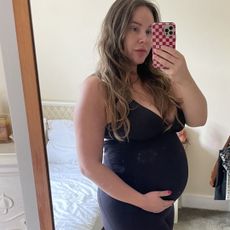 Valeza wearing workout clothes after a pregnancy pilates workout