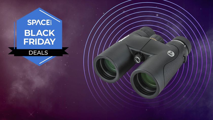 A pair of Celestron Nature DX ED 8x42 binoculars in front of a space background. 