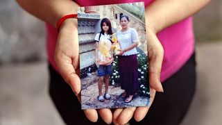 Woman holding photograph