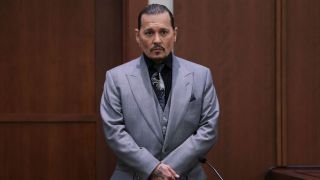 Johnny Depp in court with a suit on.