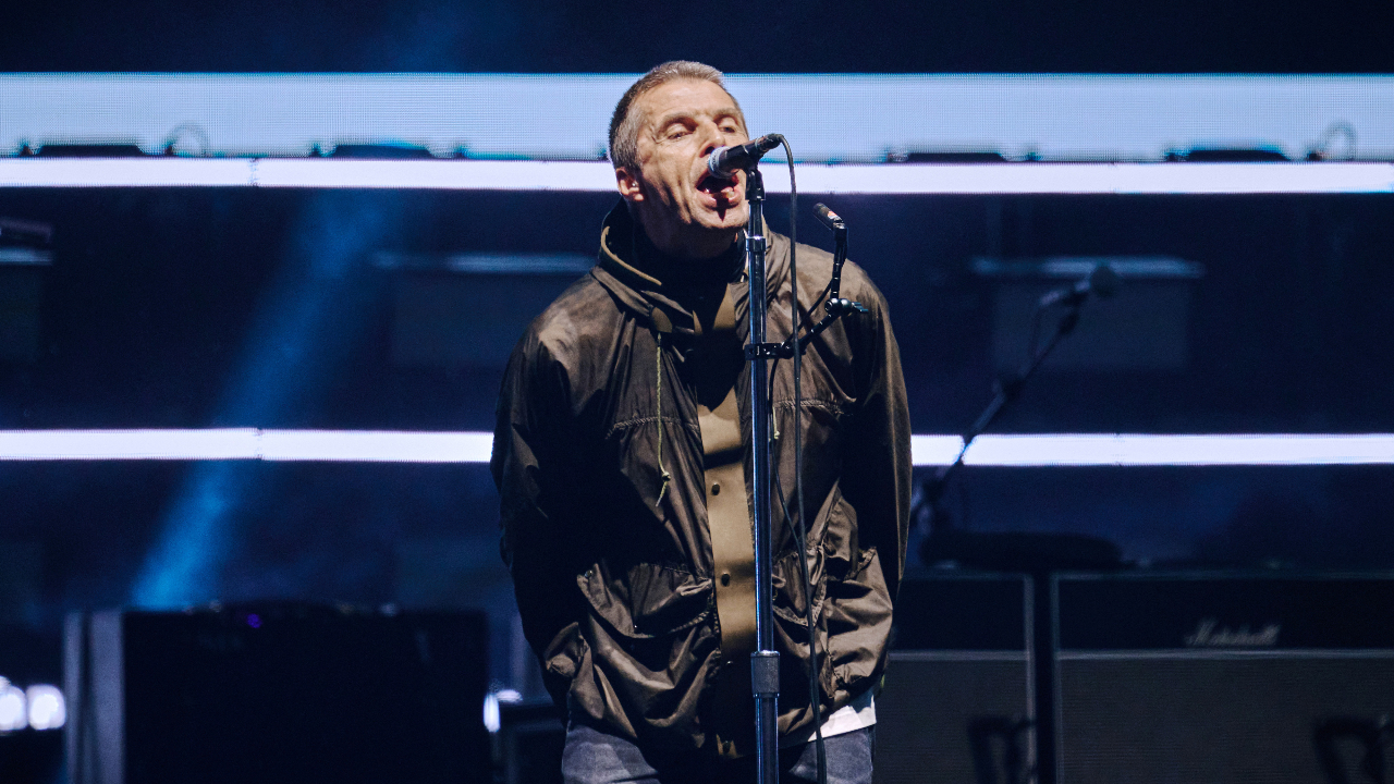 Liam Gallagher singing on stage