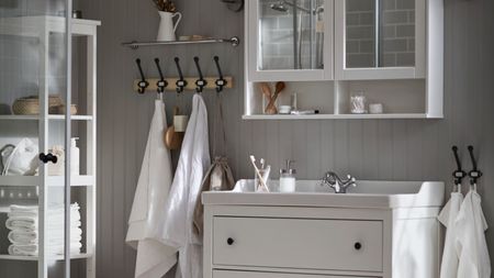 Neutral IKEA bathroom with white storage units