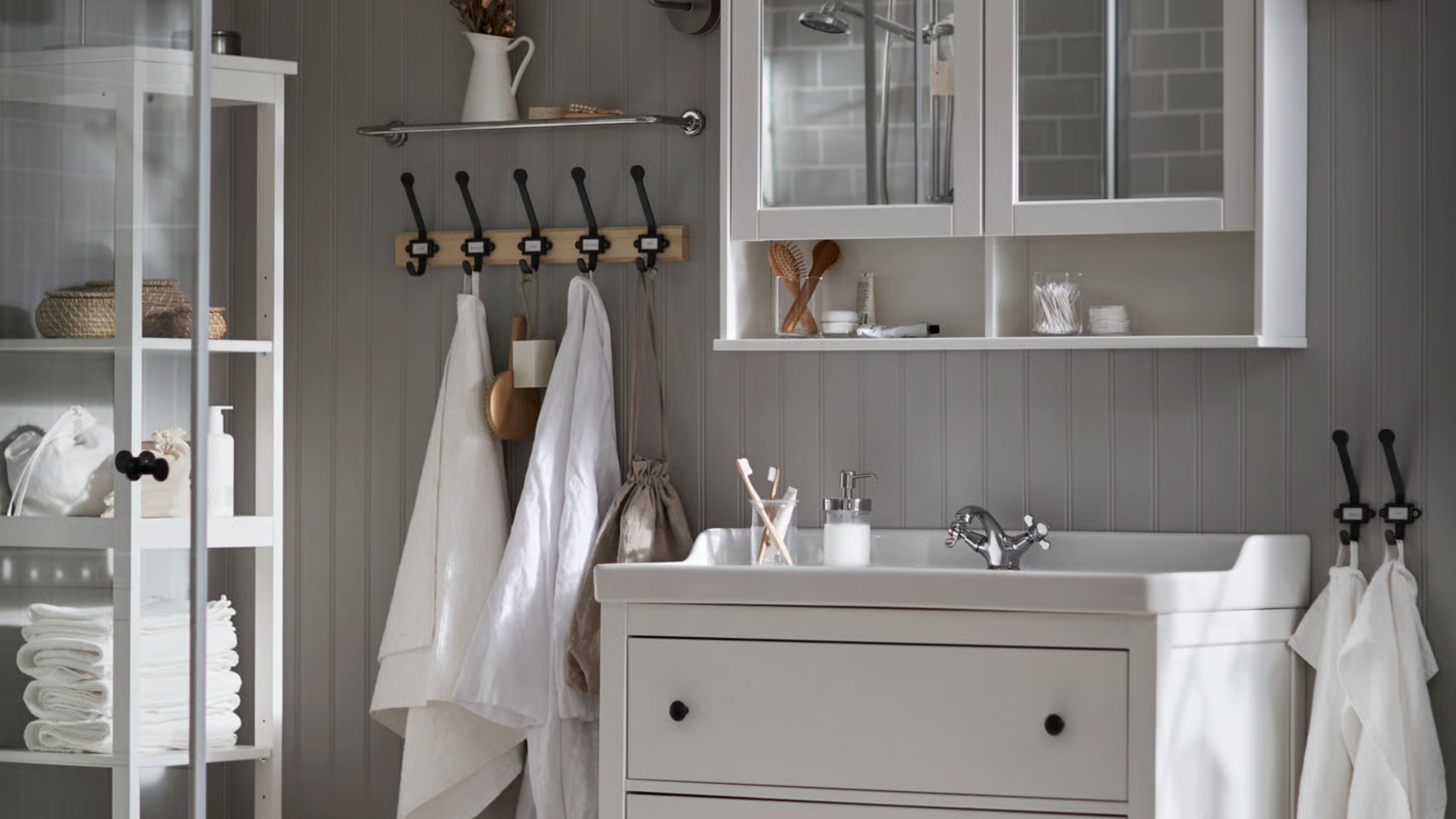 Neutral IKEA bathroom with white storage units