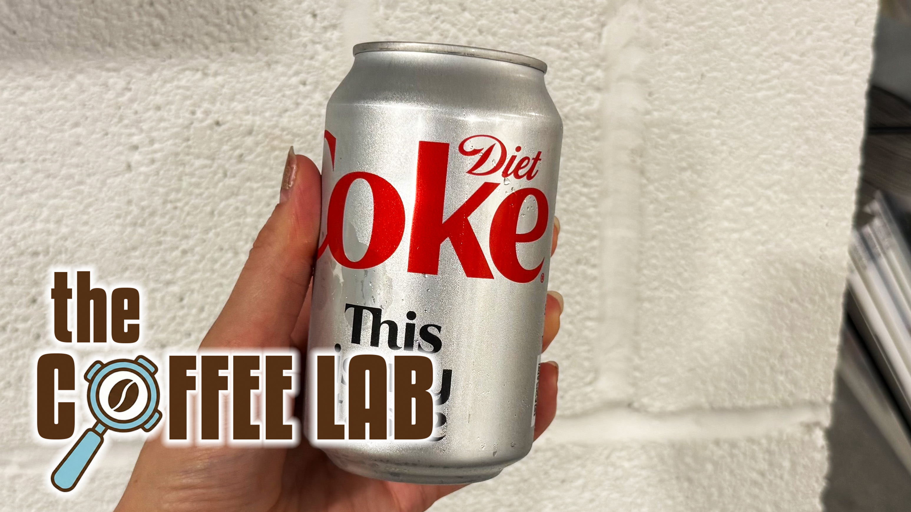 a photo of a diet coke with the coffee lab logo