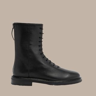 flat lay image of black leather boots