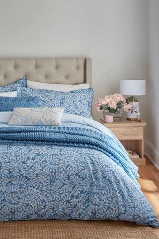 Katie Piper blue leaf print bedding set with throws and cushions