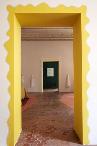 A yellow fringed doorway