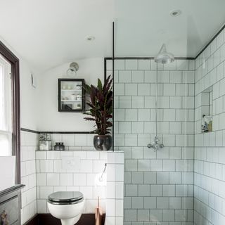 small bathroom with white metro tiles and walk in shower