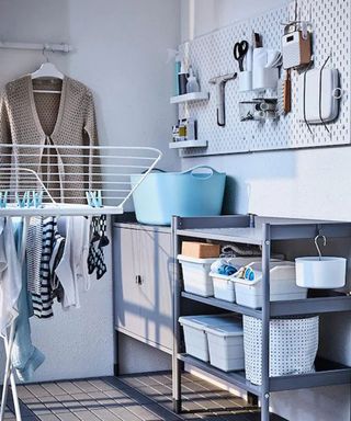 ikea's peg board and clothes dryer in a utility room with open shelving